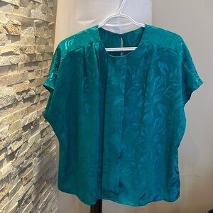 Green sleeveless blouse